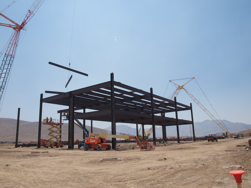 Construction continues apace. The crane lifts three massive steel bars at a time in the interest of speed and efficiency. Photo credit: Michael Ballaban/Jalopnik